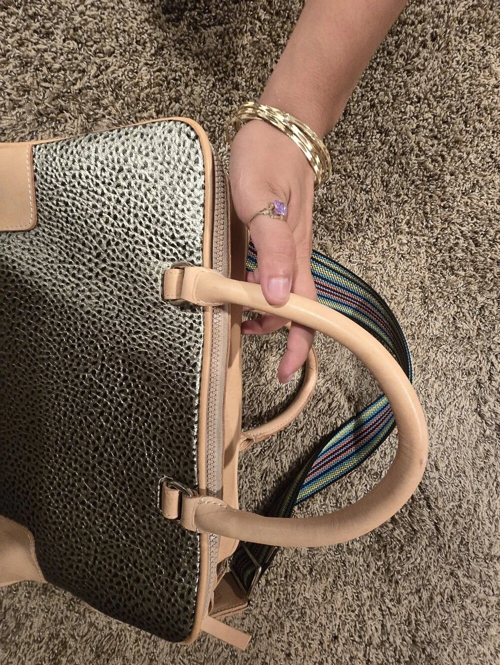 Consuela Tommy Satchel With a textured gold exterior & natural leather handles